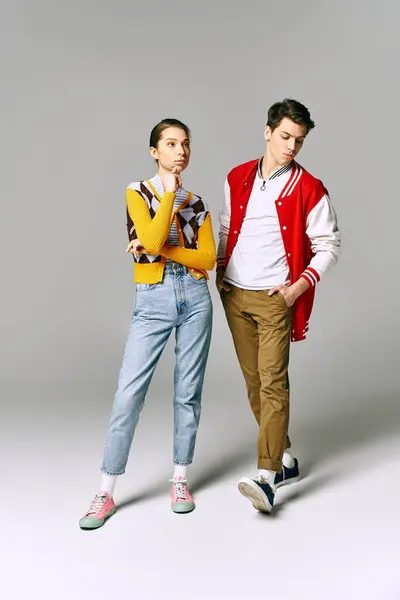 Young male and female students in casual attire posing playfully in a college classroom. — Stock Photo