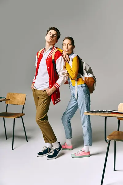 Stylish students pose in classroom setting, exuding casual charm. — Photo de stock