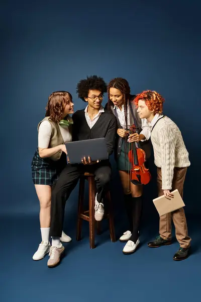 A diverse group of young friends, stand together in stylish attire on a dark blue background. — Stock Photo