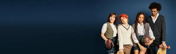 Multicultural friends and a nonbinary person stand together in stylish attire against a dark blue background. — Stock Photo
