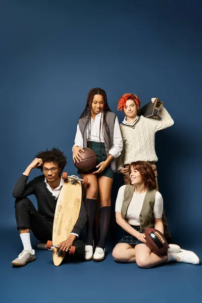 Multicultural friends, posing with skateboard in stylish attire against dark blue background. — Stock Photo