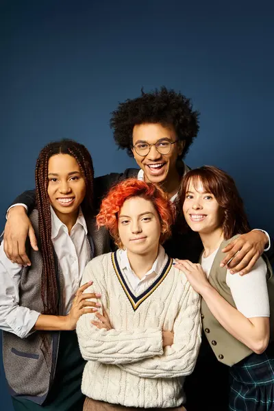 Multicultural friends, stand together in stylish attire on a dark blue background. — Stock Photo