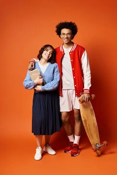 A man and a woman, stand together in stylish attire in a studio setting, showcasing unity and diversity. — Stock Photo