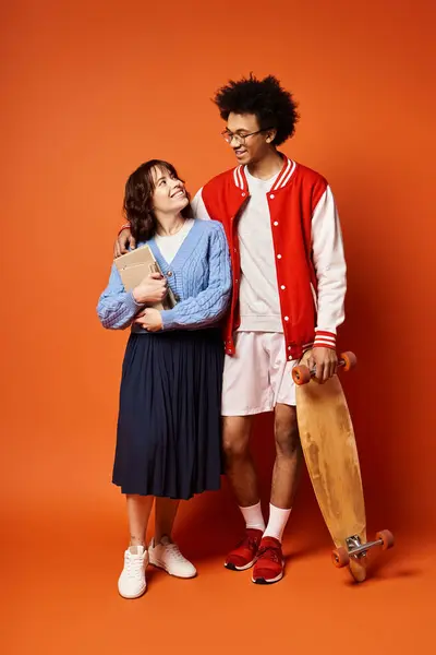 A young multicultural students stand together in stylish attire in a studio setting. — Stock Photo