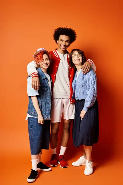 Multicultural friends, including nonbinary person, stand together in stylish attire in studio setting. — Stock Photo