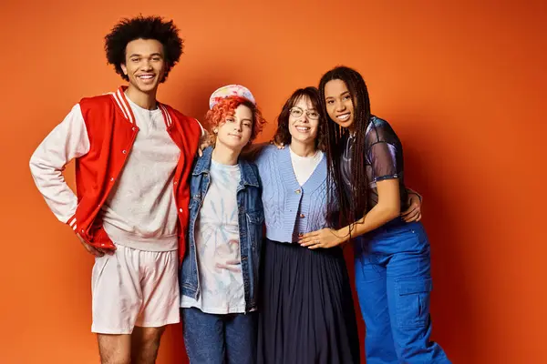 A diverse group of young friends, stand together in stylish attire in a studio setting. — Stock Photo