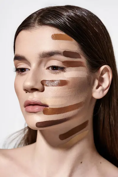 Appealing young woman adorned with layers of foundation, showcasing intricate makeup artistry. — Stock Photo