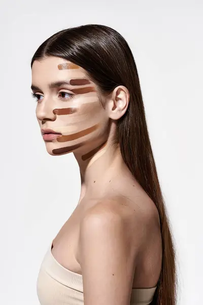 Graceful young woman adorned with layers of foundation, showcasing intricate makeup artistry. — Stock Photo