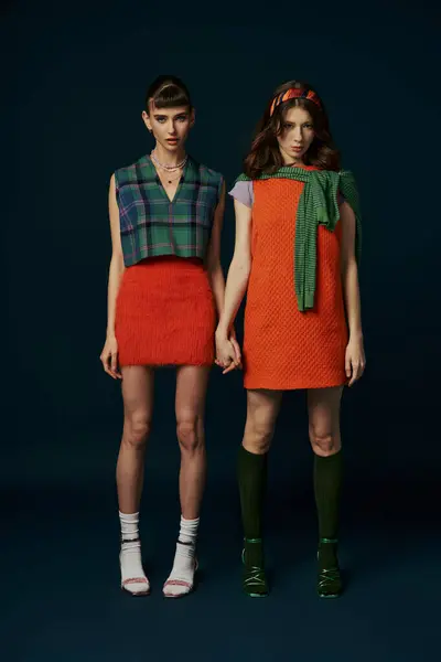 A beautiful lesbian couple in comfy attire standing together. — Stock Photo