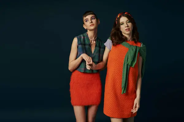 Two women in dresses standing side by side. — Stock Photo