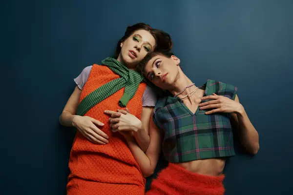 Two women in cozy outfits embrace, radiating grace and harmony. — Stock Photo
