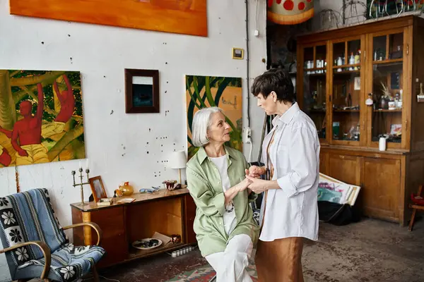 Two women create art in room. — Stock Photo