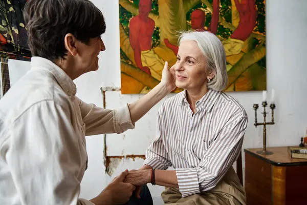 Two women spending time in art studio together. — Stock Photo