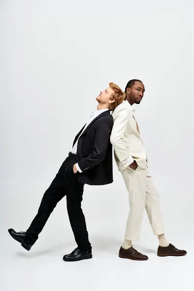 Multicultural men strolling elegantly together. — Stock Photo