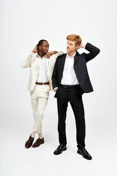 Handsome multicultural men in elegant suits posing together. — Stock Photo