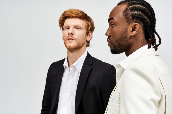 Two handsome multicultural men with elegant attire standing together. — Stock Photo