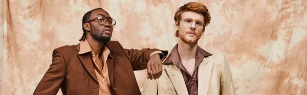 Two elegant, multicultural men exude confidence in dapper attire, standing side by side. — Stock Photo