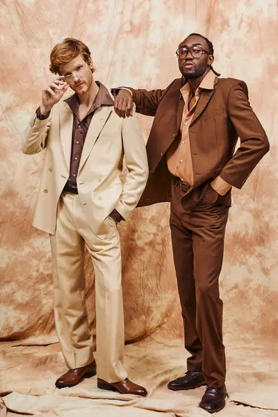 Two elegant men standing side by side in stylish suits. — Stock Photo