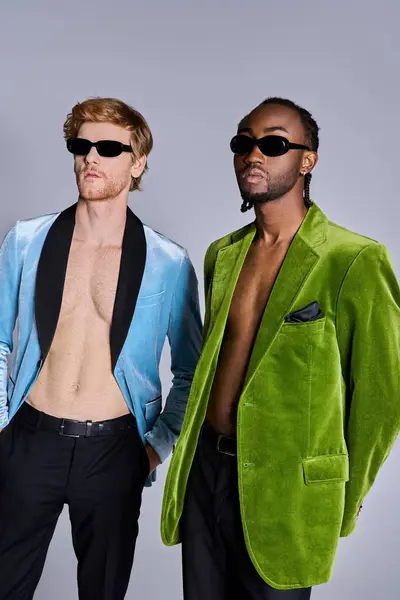Two handsome men in elegant attire striking a pose together. — Stock Photo