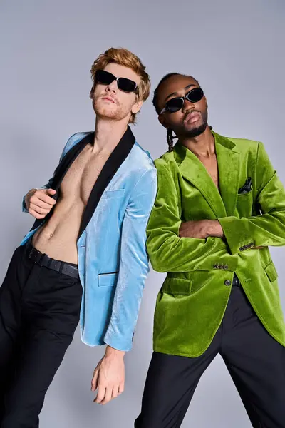 Handsome multicultural men in elegant attire stand beside each other. — Stock Photo