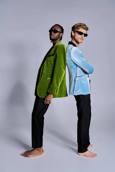 Two diverse men standing confidently next to each other in a stylish pose. — Stock Photo
