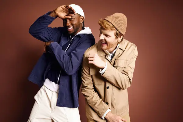 Two stylish multicultural men posing confidently together. — Stock Photo