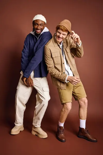 Multicultural men with stylish attire pose together for a picture. — Stock Photo