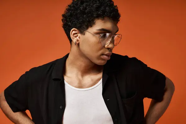 Handsome African American man wearing glasses and black shirt. — Stock Photo