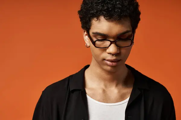 Handsome African American man in sleek glasses and black shirt. — Stock Photo