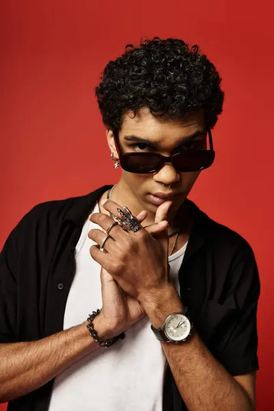Handsome African American man sporting sunglasses and a watch. — Stock Photo