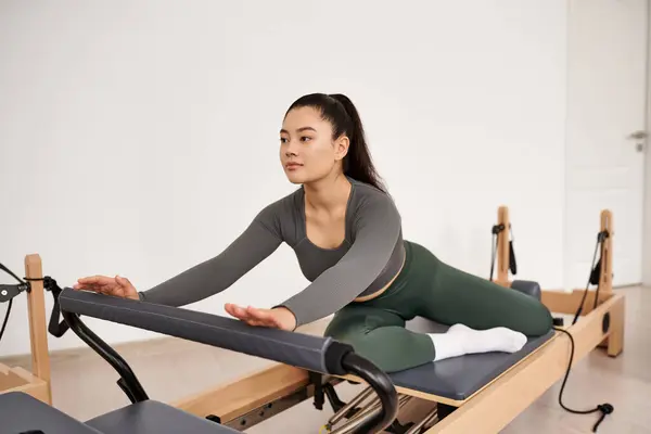 Asian woman gracefully exercising. — Stock Photo