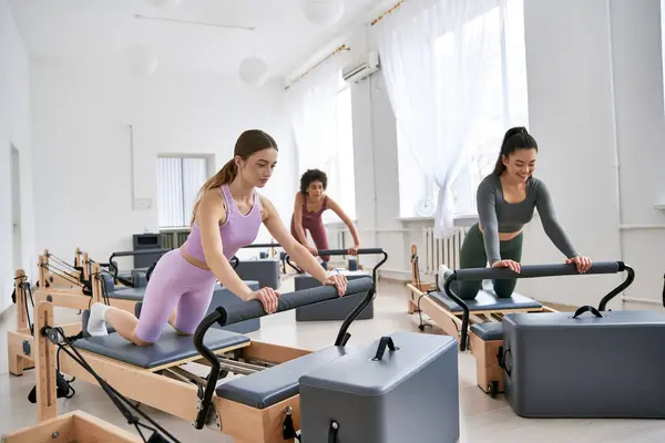 Group of women engaged in intense workout in gym setting. — Stock Photo