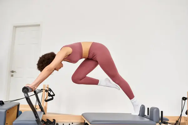 Sporty woman gracefully practicing pilates. — Stock Photo