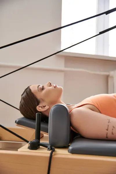 Young woman on a pilates lesson. — Stock Photo
