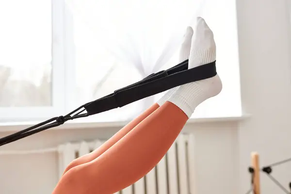 Sporty womans legs adorned with white socks. — Stock Photo