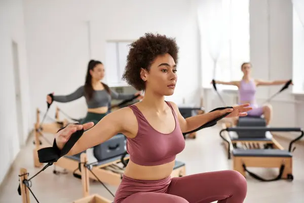 Group of sporty women practicing pilates in a studio. — Stock Photo