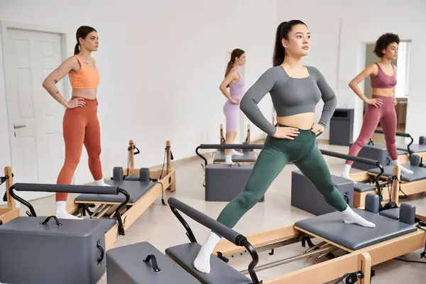Group of sporty women exercising in a pilates class. — Stock Photo