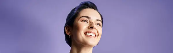 A young woman with short blue hair happily smiles — Stock Photo