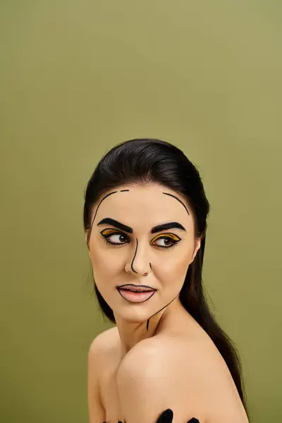 A pretty brunette woman wearing makeup resembling pop art, concealing her face with a fake mask and wearing black gloves. — Stock Photo