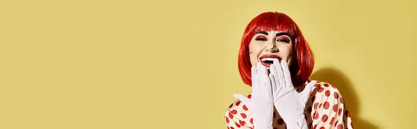 A striking redhead with pop art makeup and white gloves, exuding charm and mystery on a vibrant yellow backdrop. — Stock Photo