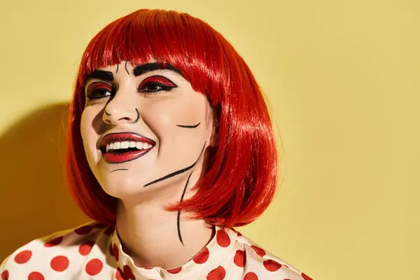 A pretty redhead woman with creative pop art makeup wearing a polka dot shirt against a vibrant yellow background. — Stock Photo