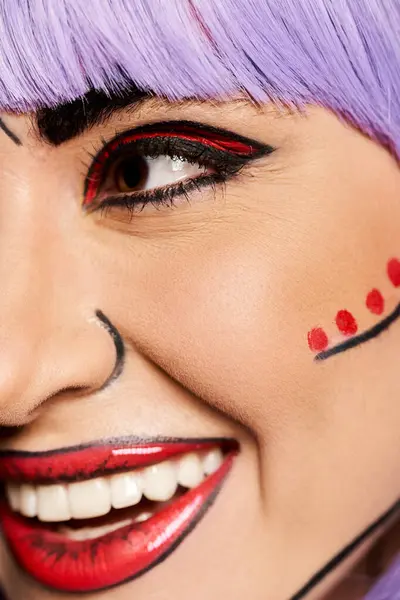 A woman wearing a purple wig and vibrant pop art makeup, exuding creativity against a black backdrop. — Stock Photo