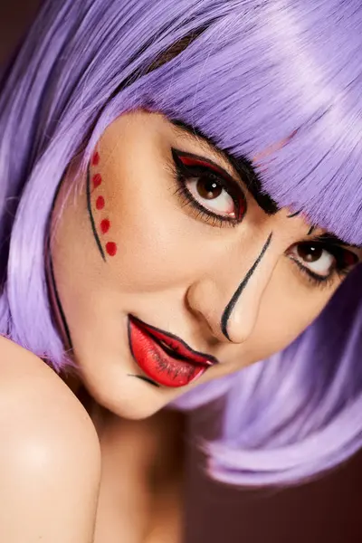 Woman with purple wig and colorful pop art makeup, resembling a character from comics, poses on a black background. — Stock Photo