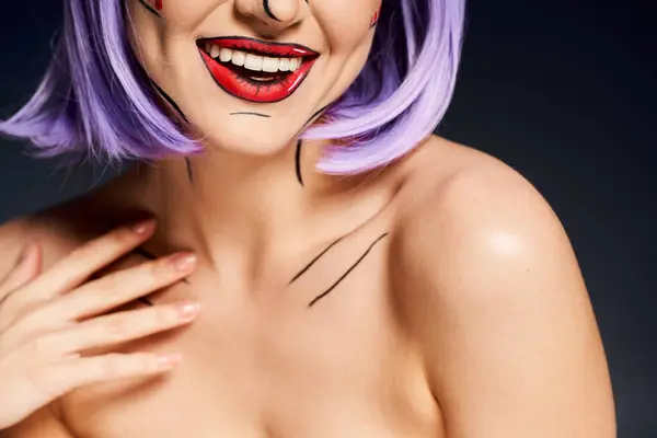A pretty woman with a purple wig and clown makeup, resembling a character from comics, against a black background. — Stock Photo