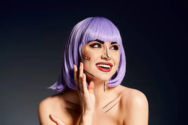 A charismatic woman with vibrant purple hair and bold pop art makeup strikes a pose against a black backdrop. — Stock Photo