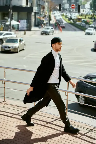 Young red-haired man strolling beside city street in debonair attire. — Stock Photo