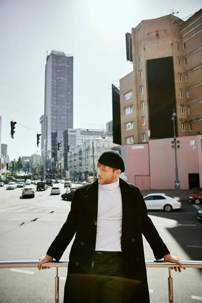 Stylish redhead man in city chic ensemble leans casually on street rail. — Stock Photo