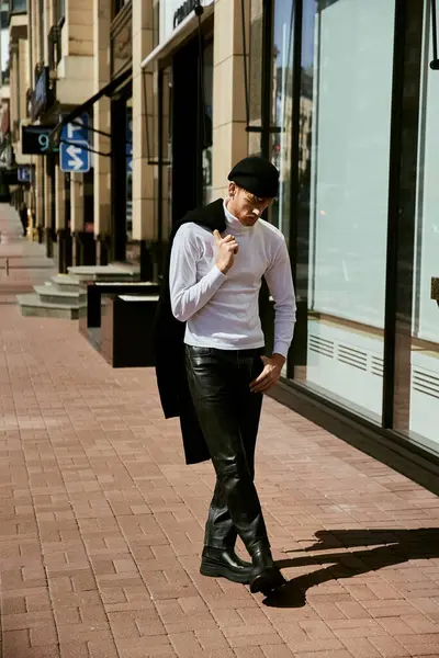 A young red-haired man in debonair attire stands on a city sidewalk in front of a store. — Stock Photo