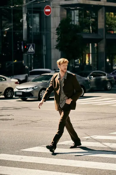 Stylish redhead man in debonair suit walking in city street. — Stock Photo