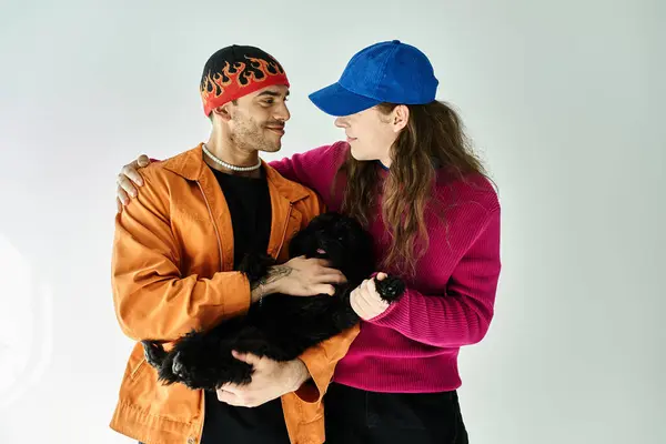 Two men lovingly hold a dog. — Stock Photo